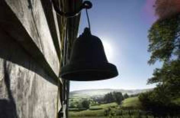 A bell hanging on the wall