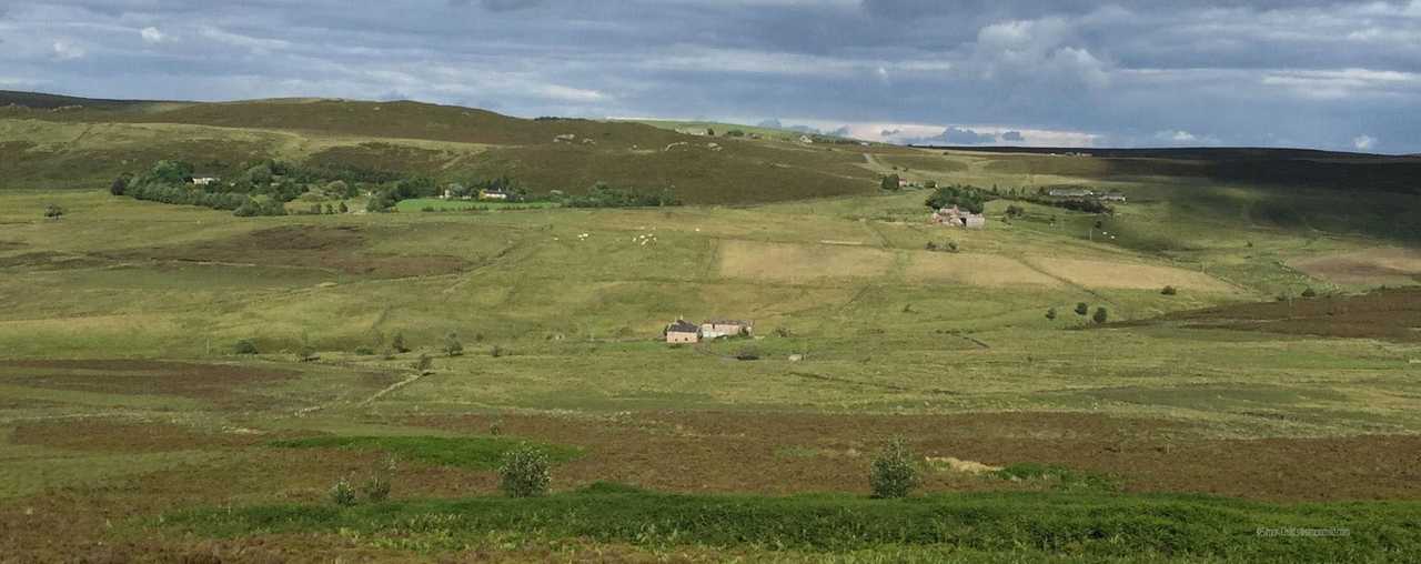 Shawbottom viewed from the hillside, isolated and standing alone in the valley
