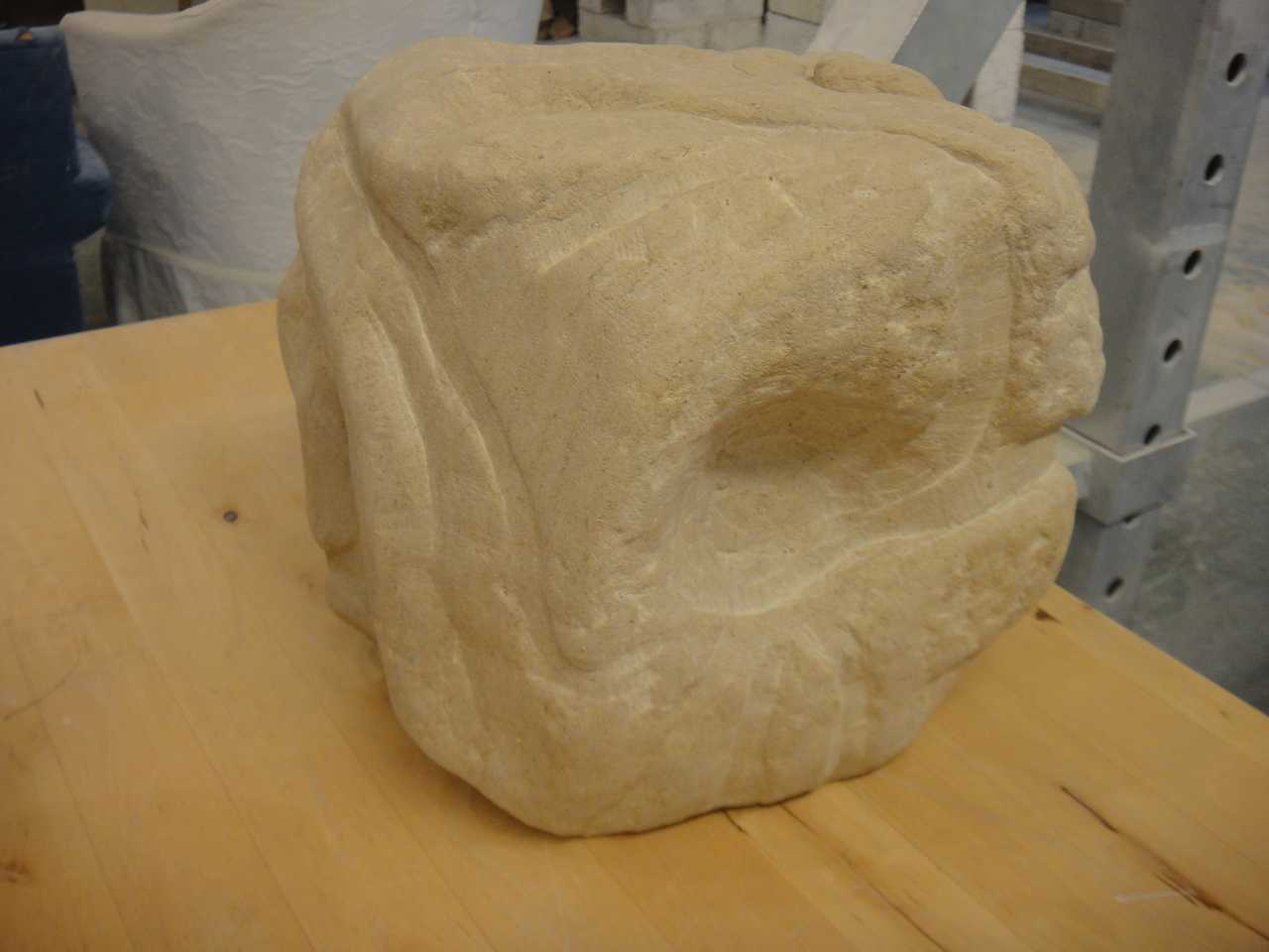 A stone carving lying on a table