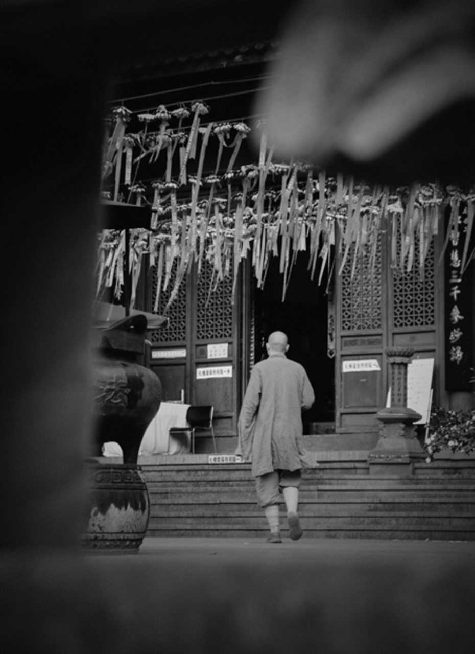 A monk entering a Chinese Buddhist temple