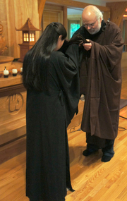 Rebecca Li receiving the transmission robe from Simon Child